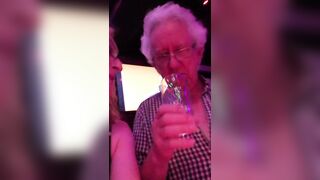 Lisa Peeing in a Glass in the Bar Toilets and Sharing it with Pauline and John.