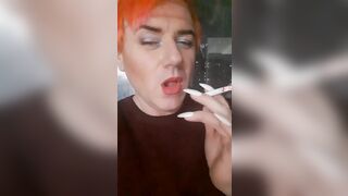 transvestite Sonyastar smokes, lengthy nails, red hair
