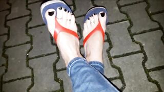 a night stroll out of pants in constricted jeans and flip-flops