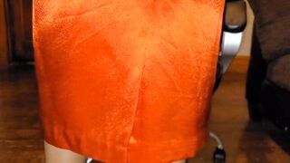 Lengthy lined orange satin petticoat with a white silky half slide.