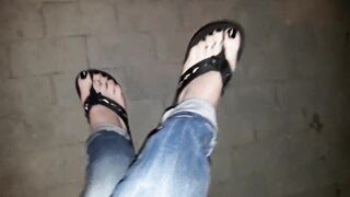 a crossdresser on a night walk walks around and tempts with his gorgeous feet