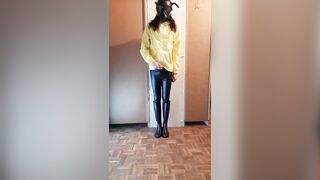 Transgirl jerks off in raincoat
