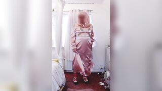 Sissy crossdresser in full length pink satin suit