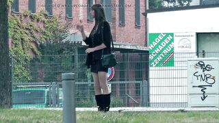 Crossdresser shemale in short petticoat and boots outside