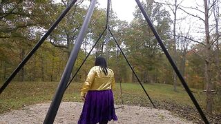 Hot Crossdresser at the park getting willing to begin swinging on the swing in the park.