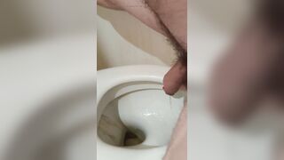 peeing in toilette with red toes