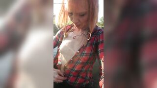 Swimming in jeans and shirt in river.