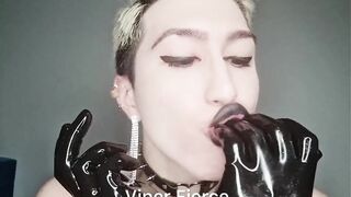 Kinky sissy in shiny latex bodysuit and high boots plays with weenie and cums in her throat