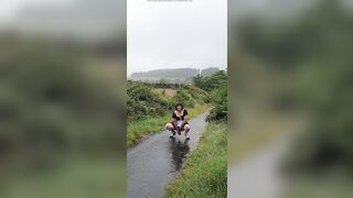 Crossdressing floozy Maid on a public lane in the rain