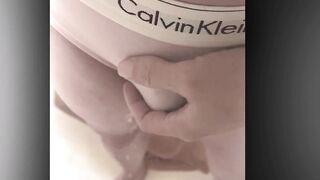 Peeing in pink pants.