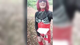 Sissy bitch in red outfit and haunch high boots by the side of the road