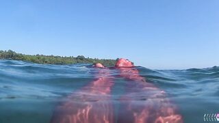red stocking in the sea at the public beach