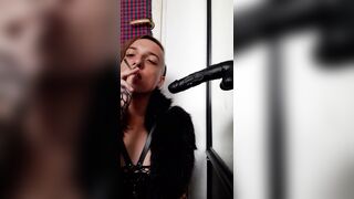 Punk trans gal sucking a ebony sex-toy whilst smokin'