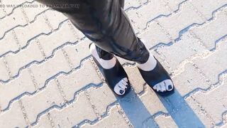 a walk in very high wedges and latex leggings