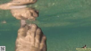 bodysuit and stocking tease beneath the sea