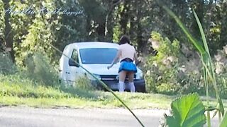 Outdoor car windows cleaning by the road