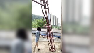 sissy wearing high heels and denim top at the construction website 1