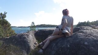 Exhibitionist trans angel touches herself on a rocky beach