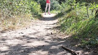 Showing my large ramrod in the public woods in slut outfit
