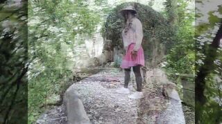 Tammy CD Whore in nature's garb outdoors at a local park