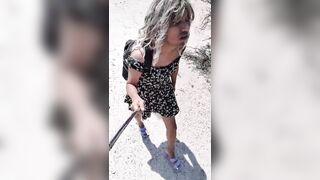 ladyboy floozy walks in public wearing mini petticoat high heels cute legs and plug in booty very sexy