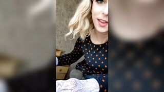Transsexual twists her butt in front of the window, seducing random passers-by and walks in the entrance clothed in babes's garments