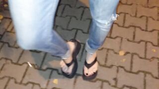crossdresser with outstanding feet on a night walk in the park