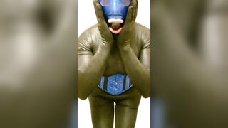 Hawt fake bazookas in spandex and corset with silicone gag and latex hood