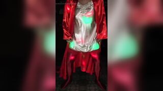 Dancing in a red pajama costume.
