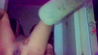 Tgirl dilating her booty with an orange