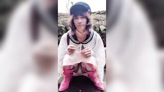 Just a glimpse of her pants outdoors.