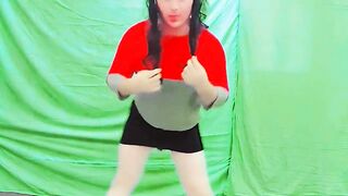 Cute femboy lifting petticoat slightly beneath soft lights