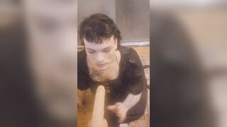 Trans woman on floor sucks sextoy