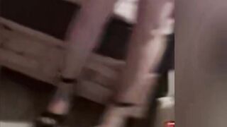 Dude wearing hot red dreas hose and heels