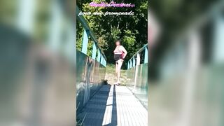 Effortless clip where I show my anal-plugged on a footbridge during a hike