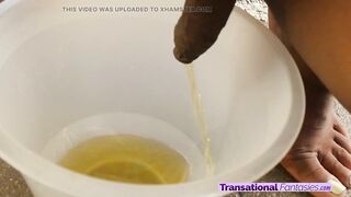 Nice-looking black trans angel pees