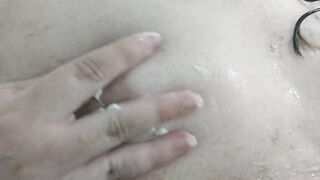 Bulky trans beauty playing with her titties and a sex toy on the shower