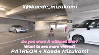 crossdresser doing an exhibition play in a parking lot