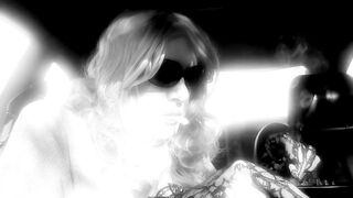 MRS. ROMAN SMOKIN' MARLBORO 100's IN HER CAR