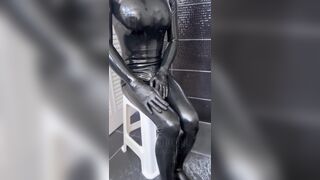 Latex bodysuit and high heels