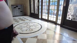 Masturbating with a cum drum at the entrance to the building