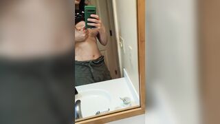 sprying a little milk at the mirror