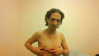 Topless Transgirl Trying to Hold a Pen w/Her Small Melons