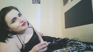 emo cutie smokes a cigarette, positions, and shows her feet