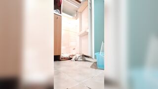 Transvestite cleans the fridge and eats his cum