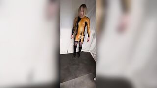 Hawt blond dressing up in latex, red nails, boots and nylons posing.