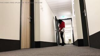 Crossdresser exposing in hotel hallway