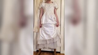 Trying on a liquid satin wedding costume.