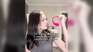 Trans angel holds pink toy and asks for aid using it ?