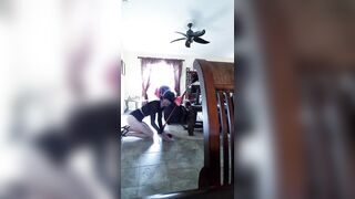 crossdresser maid in her ebony bikini belt.